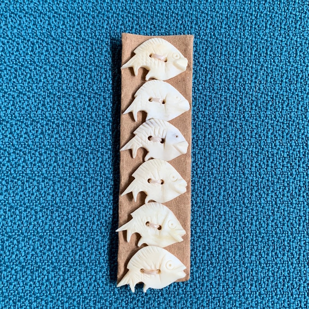 Hand carved fish buttons